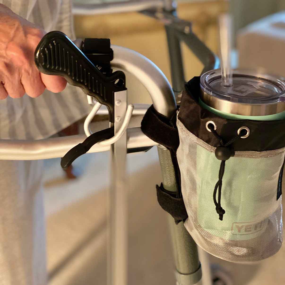 ThinkKing-cupholder-walker-water-bottle cup holder with a water bottle on a walker