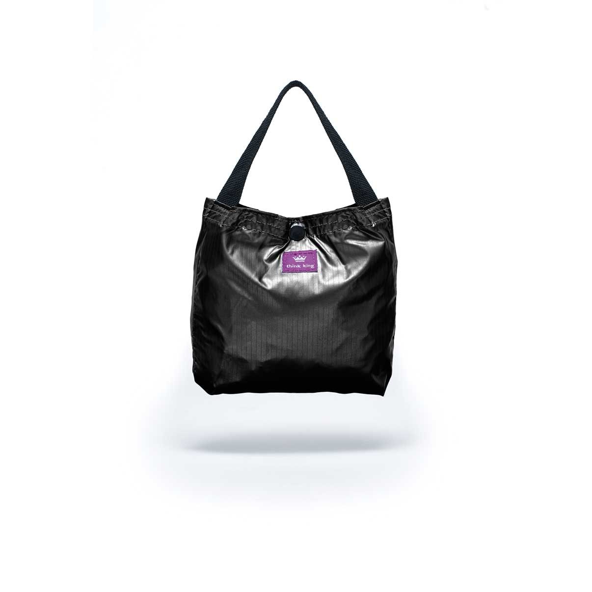 Folded Think King reusable packable tote bag shiny black