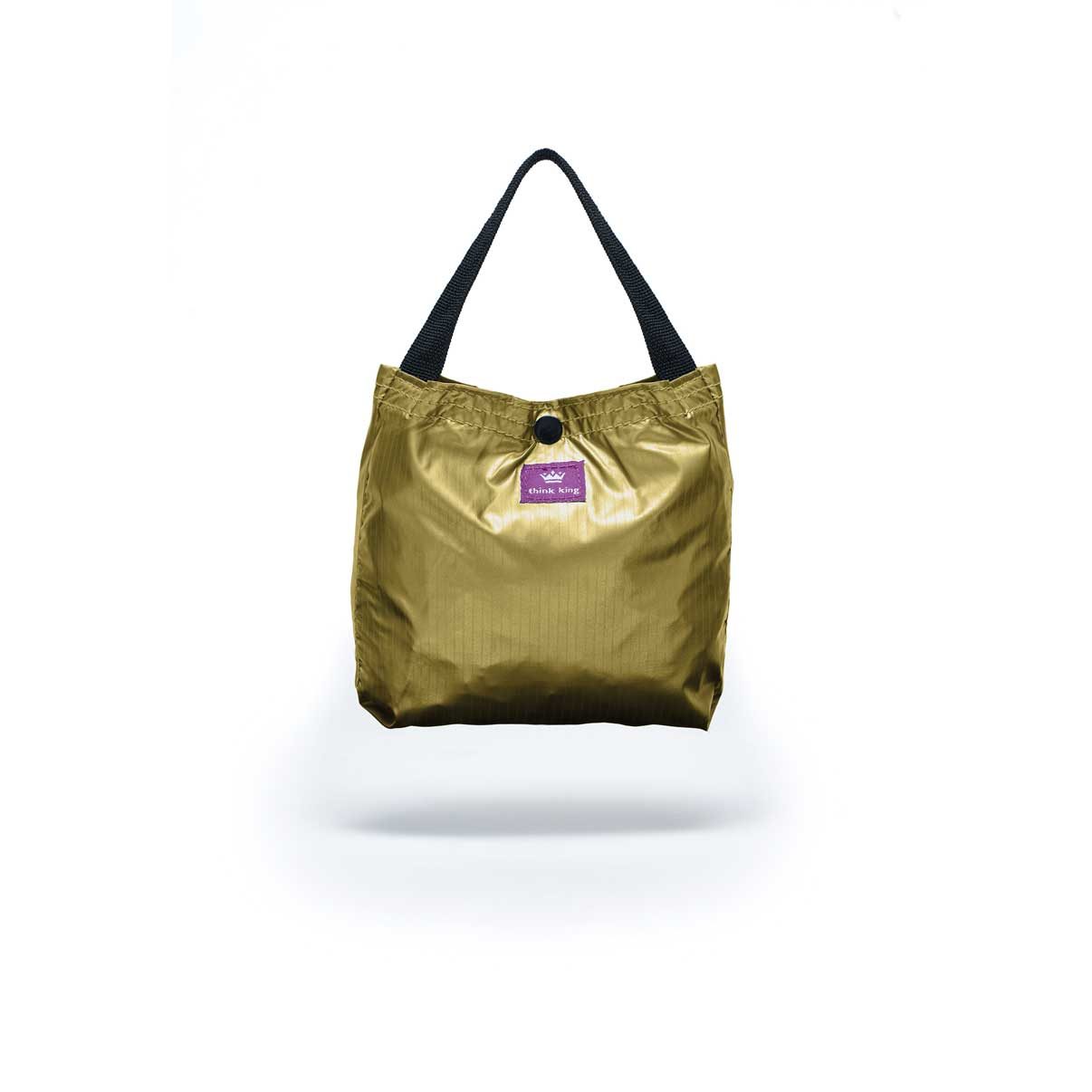 Folded Think King reusable packable tote bag metallic gold