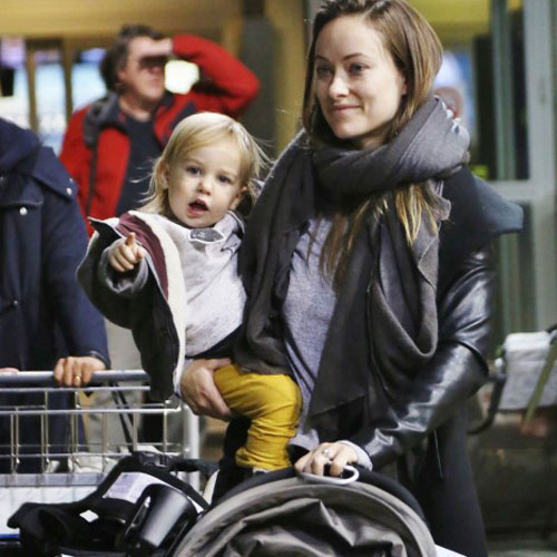 Olivia Wilde pusing a baby stroller with the Jumbo Swirly Hook on the bar